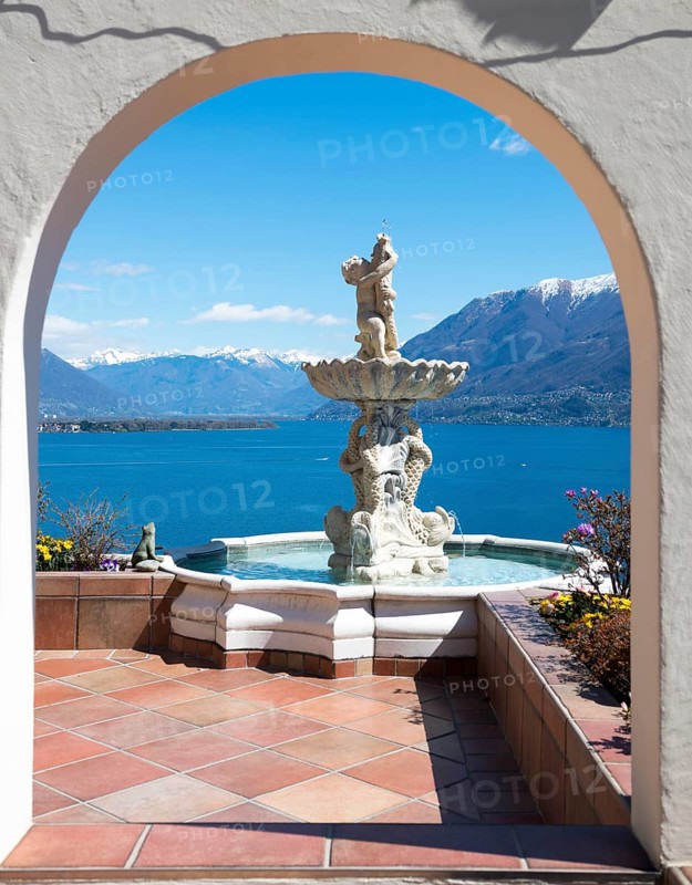 Patio with a Statue with Panoramic View over Lake Maggiore and Snowcapped Mountain in a Sunny Day in Ronco sopra Ascona, Ticino, Switzerland, Europe