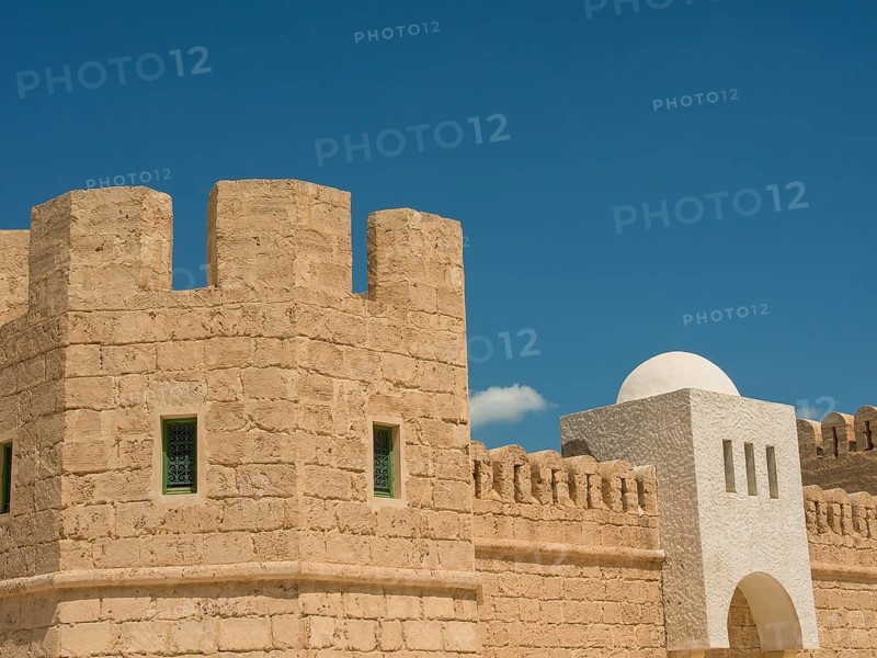 Close-up of a historic fortress with stone walls against a clear blue sky, Tunis in Africa with ruins from Roman times, modern mosques and blue and white houses in sidi-bou-said, Tunis, Tunisia, Africa