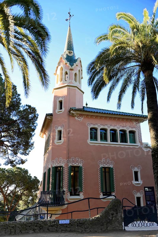 Antoni Gaudi, Park Guell, UNESCO World Heritage Site, Barcelona, Catalonia, Spain, Europe, Modernist tower-like building with palm trees in the foreground, Europe