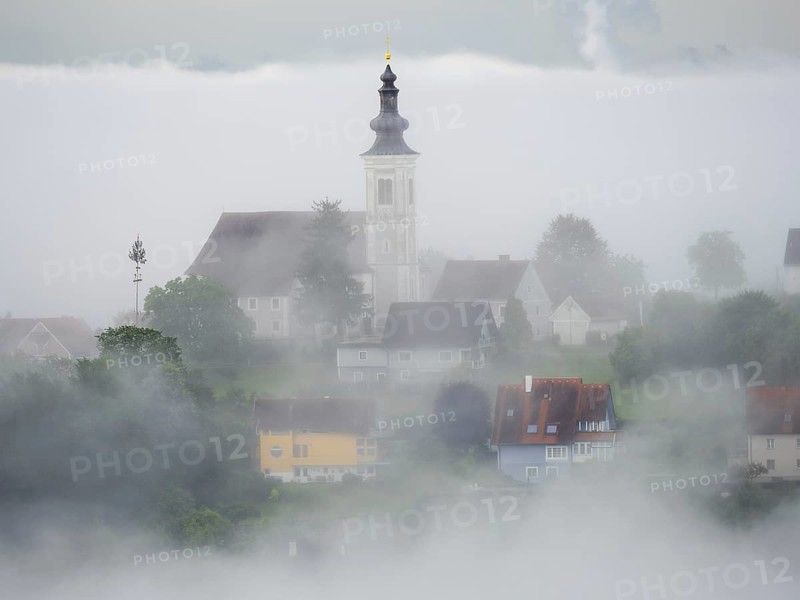 Church rises out of the morning mist, Frauenberg pilgrimage church, near Leibnitz, Styria, Austria, Europe