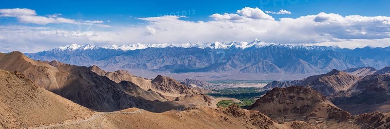 Panorama from the Khardong Pass, the second highest motorway pass in the world, over Leh and the Indus Valley to Stok Kangri, 6153m, Ladakh, Jammu and Kashmir, India, Asia