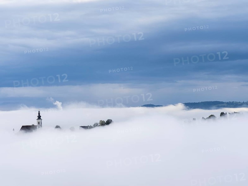 Church tower rises out of the morning mist, Frauenberg pilgrimage church, near Leibnitz, Styria, Austria, Europe