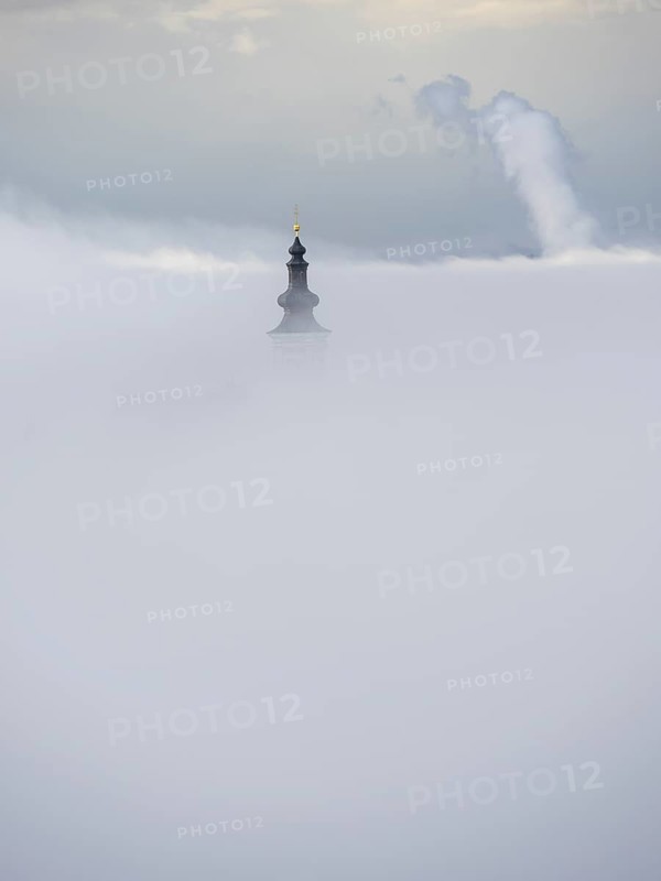 Church tower rises out of the morning mist, Frauenberg pilgrimage church, near Leibnitz, Styria, Austria, Europe