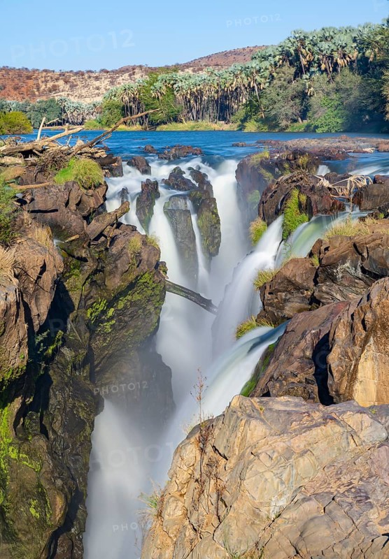 Epupa Falls waterfall on the Kunene River backlit, long exposure, Kunene, Namibia, Africa