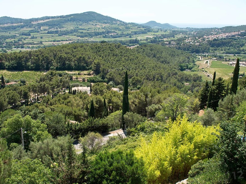 A vast green landscape with hills and forests under a clear blue sky, Provence, le Castellet, France, Europe