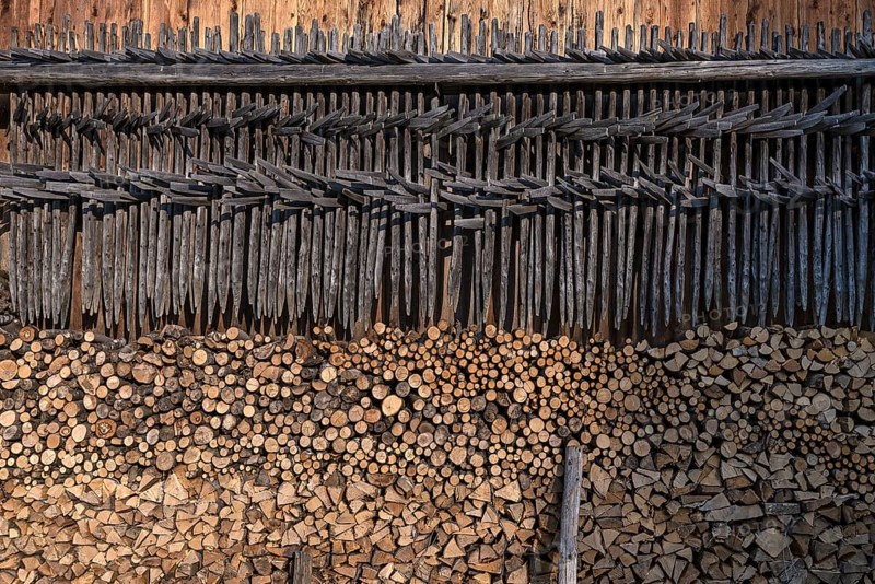Stacked firewood and hanging hay, hay dryer at a barn, Bad Oberdorf, Allgaeu, Bavaria, Germany, Europe