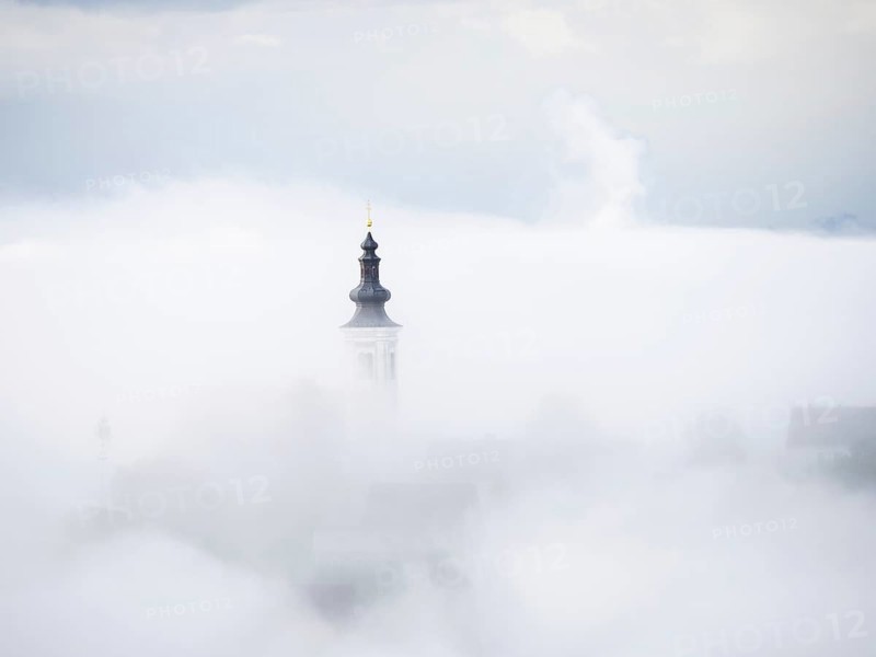 Church tower rises out of the morning mist, Frauenberg pilgrimage church, near Leibnitz, Styria, Austria, Europe