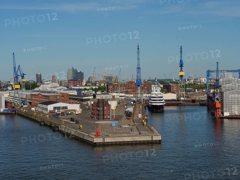 Industrial harbour area with cranes and ships in the water under a clear sky, Gorse city on the river with harbour, shipyards, houses and ships, Hamburg, Germany, Europe