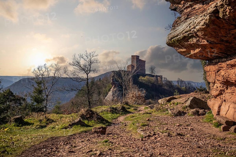 View of Trifels Castle, from Engels Landing rock, with the young tower in autumn at sunset. Beautiful landscape in the Palatinate Forest, Rhineland-Palatinate, Germany, Europe