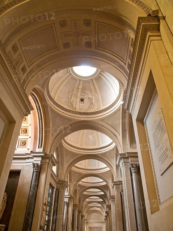Interior view of a historic building with dome and vaults in bright light, palermo in sicily with an impressive cathedral, monuments and old houses with balconies, palm trees and flowers in italy, palermo, sicily
