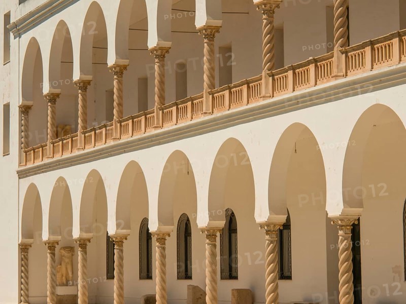 Historic building with sandstone arches and colonnades, Tunis in Africa with ruins from Roman times, modern mosques and blue and white houses in sidi-bou-said, Tunis, Tunisia, Africa