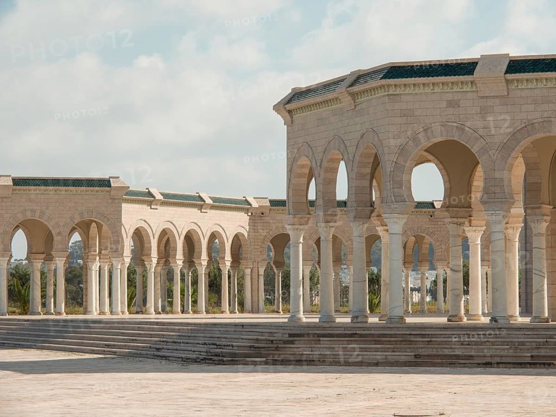 Spacious stone structure with arcades and columns on a square, Tunis in Africa with ruins from Roman times, modern mosques and blue and white houses in sidi-bou-said, Tunis, Tunisia, Africa
