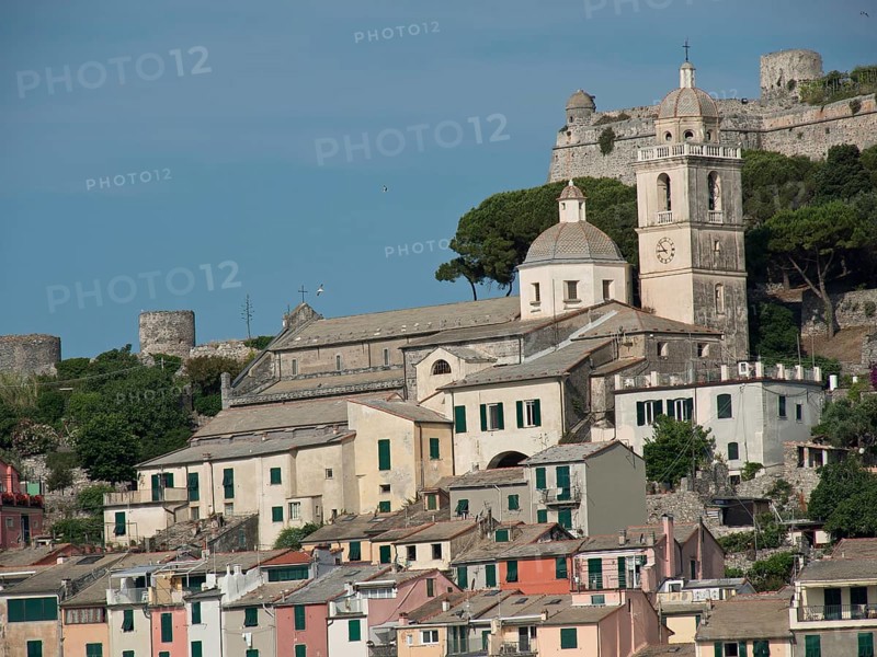 Hilly landscape with a church and bell tower surrounded by houses and castle ruins, Bari, Italy, Europe
