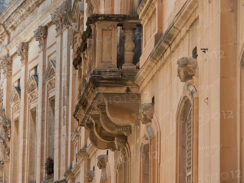 Side view of a historic building with decorative sculptures and balconies, the town of mdina on the island of malta with historic houses, colourful balconies, magnificent churches, mdina, Malta, Europe