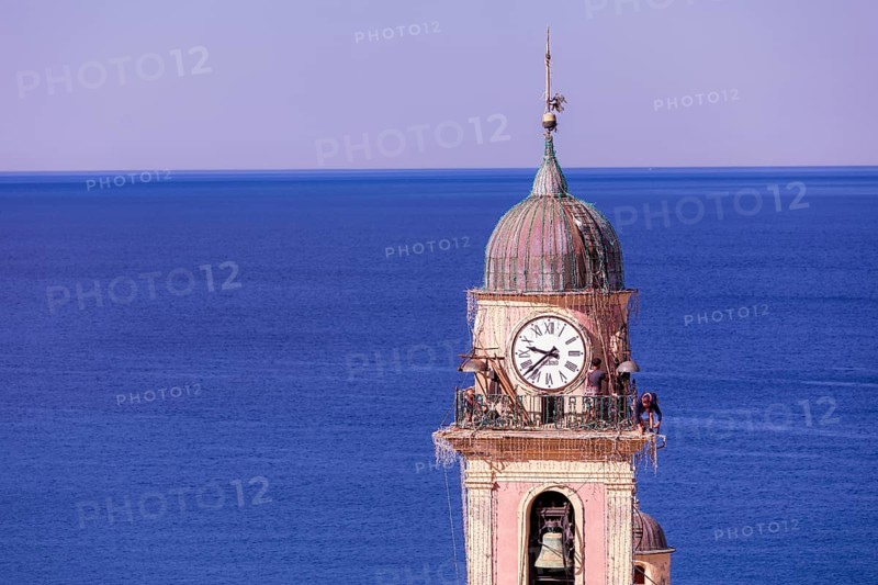 Workers at the top of Church of Santa Maria Assunta, Camogli, Liguaia, Italy, Europe