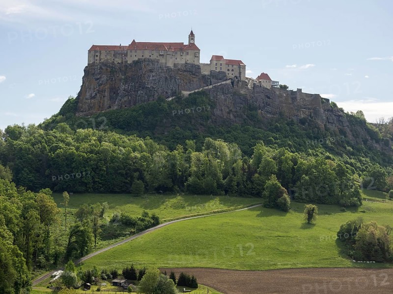 Field path leads through meadow at the edge of the forest, Riegersburg Castle in the background, near Riegersburg, Styria, Austria, Europe