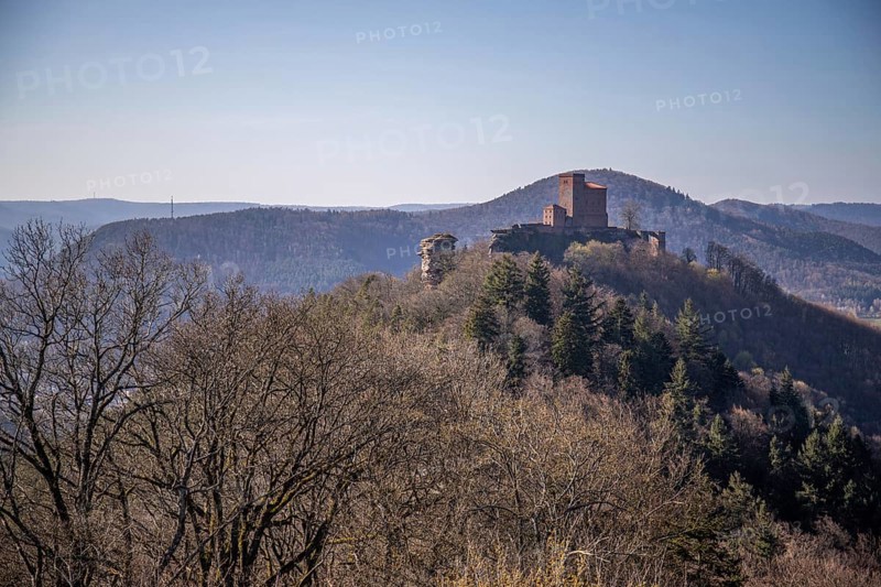 View of Trifels Castle, from Engels Landing rock, with the young tower in autumn at sunset. Beautiful landscape in the Palatinate Forest, Rhineland-Palatinate, Germany, Europe