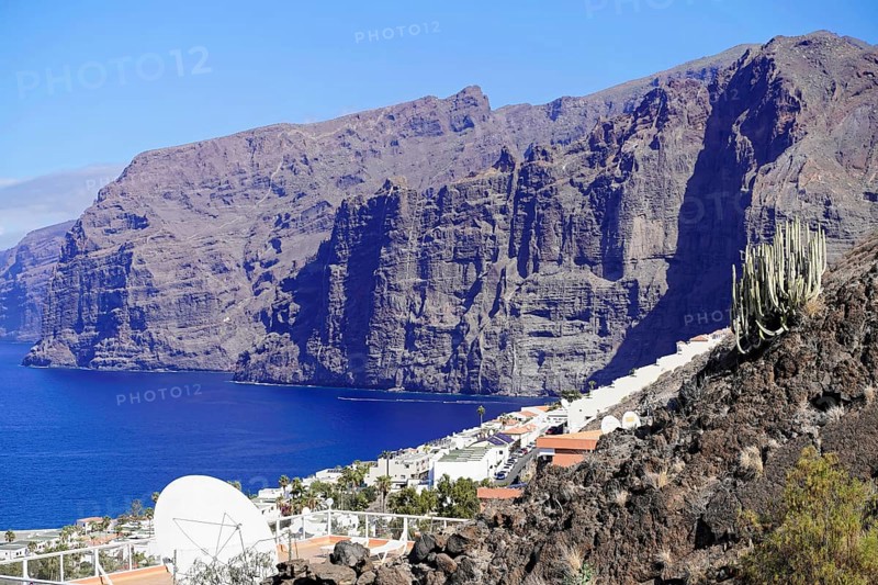 Los Gigantes cliffs, Canary Islands, Spain, Europe, Steep cliffs towering over the blue sea, with white houses on the rocky coast in sunny weather, Tenerife, Europe