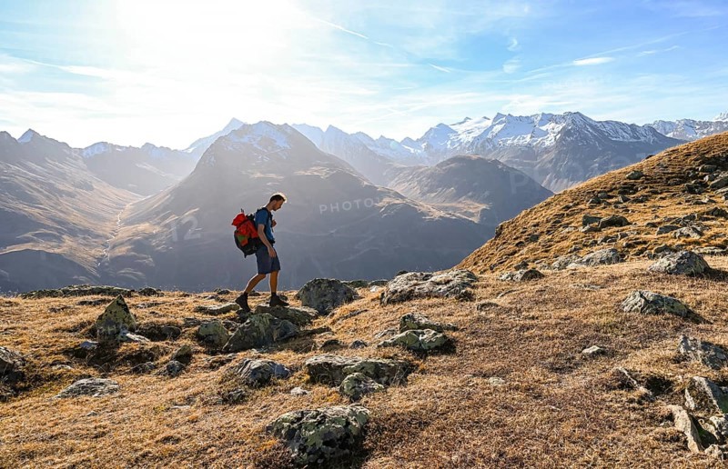Mountaineers on a hiking trail, Gurgler Seenplatte, behind glaciated mountain peaks of the Gurgler ridge, in autumn, near Obergurgl, Oetztal Alps, Tyrol, Austria, Europe