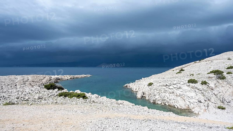 Stormy atmosphere and dark clouds on the coast, island of Pag, Zadar, Dalmatia, Croatia, Europe