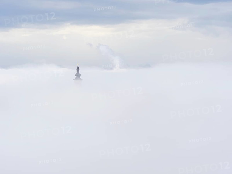 Church tower rises out of the morning mist, Frauenberg pilgrimage church, near Leibnitz, Styria, Austria, Europe