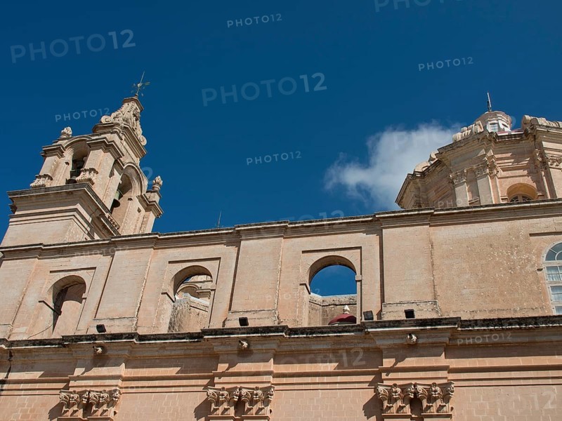 Baroque church with sandstone bell tower under a clear sky, the town of mdina on the island of malta with historic houses, colourful balconies, magnificent churches, mdina, Malta, Europe