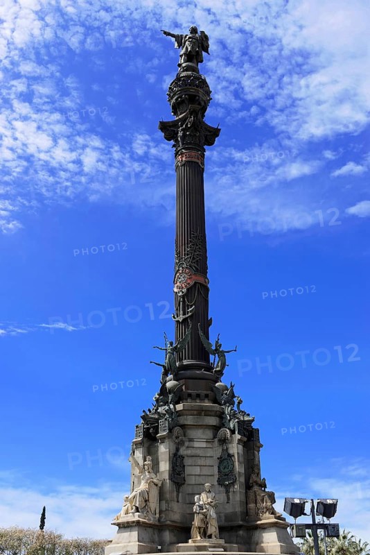 Monument a Colom, Colombus Column, Barcelona, Catalonia, Spain, Europe, High column with statue and other sculptures in front of a blue sky, Europe