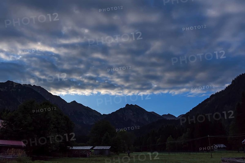 Cluster layer clouds (stratocumuli) with silhouette of the Allgaeu mountains, Hinterstein, Bad Hindelang, Bavaria, Germany, Europe
