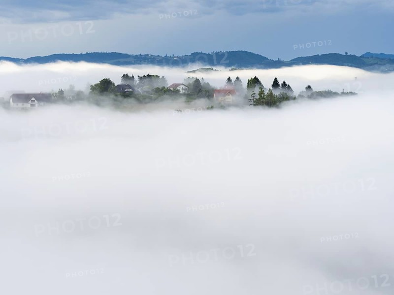 Morning fog over the village of Frauenberg, view from Silberberg, near Leibnitz, Styria, Austria, Europe