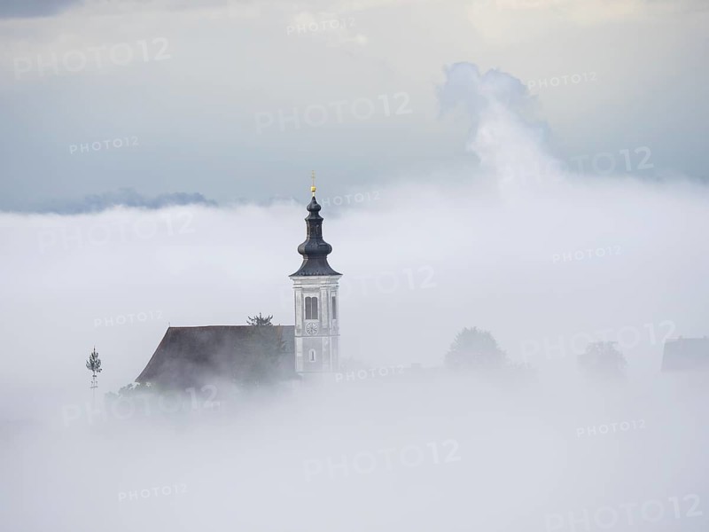 Church rises out of the morning mist, Frauenberg pilgrimage church, near Leibnitz, Styria, Austria, Europe