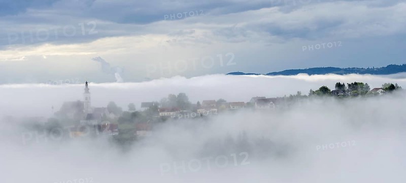 Fog clears over the village of Frauenberg, view from the Silberberg, near Leibnitz, Styria, Austria, Europe