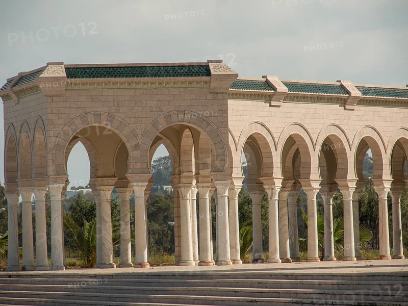 Sandstone arcades with arches and columns in open daylight, Tunis in Africa with ruins from Roman times, modern mosques and blue and white houses in sidi-bou-said, Tunis, Tunisia, Africa
