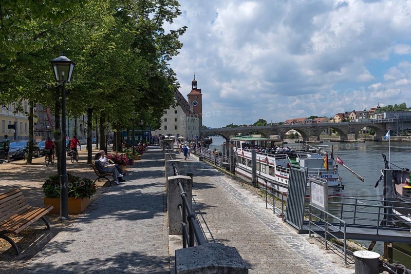 Danube promenade, behind the bridge tower museum with the Stone Bridge, Regensburg, Upper Palatinate, Bavaria, Germany, Europe