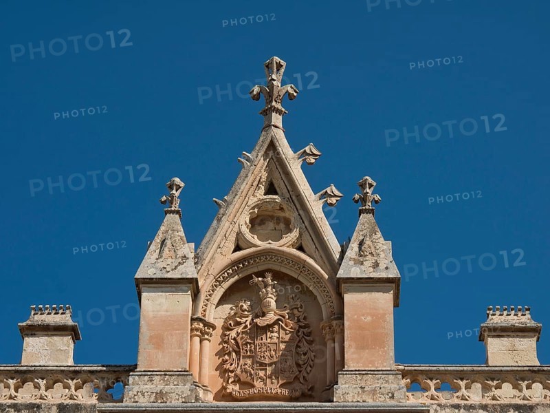 Detailed pediment with ornate coat of arms and elegantly designed spires under a clear blue sky, the town of mdina on the island of malta with historic houses, colourful balconies, magnificent churches, mdina, Malta, Europe