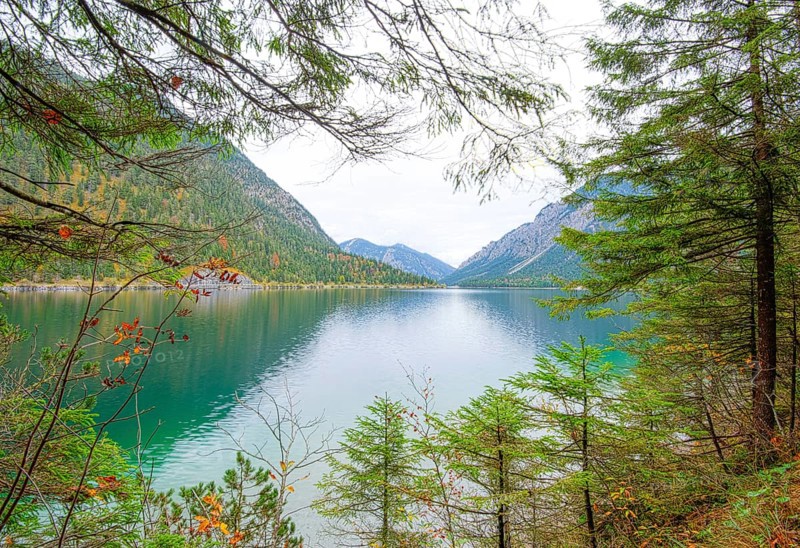 Landscape of a clear lake (Plansee) in autumn in Tirol
