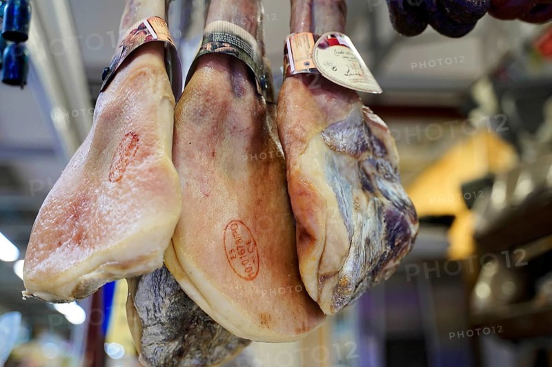 Market hall, Mercado de Nuestra Senora de Africa, Santa Cruz de Tenerife, Tenerife, Canary Islands, Spain, Europe, Hanging hams in a butcher's shop in close-up, sharp details of the meat structure, Europe