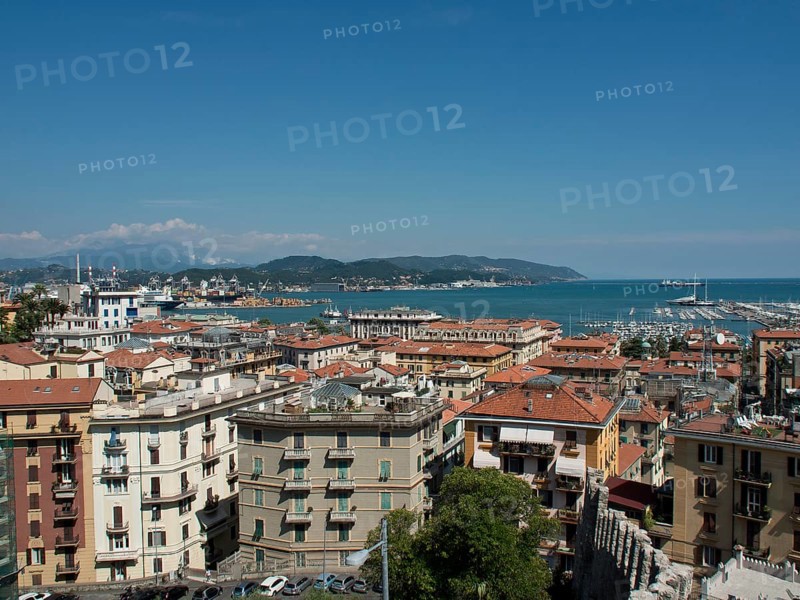 Panoramic view of a coastal town with rooftops, harbour and boats under a blue sky, Bari, Italy, Europe