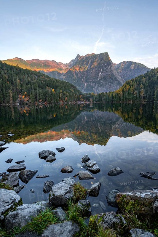 Mountain peaks of the Oetztal Alps reflected in Lake Piburger See, in autumn, near Oetz in Oetztal, Tyrol, Austria, Europe