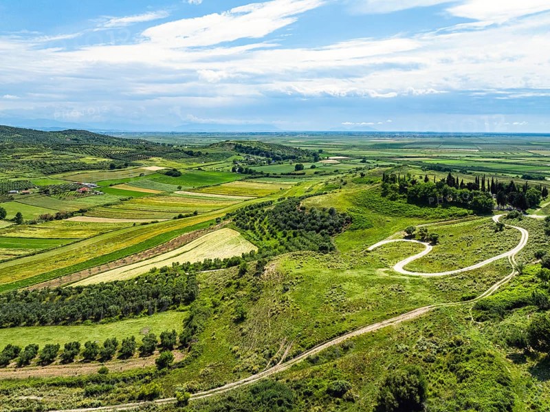 Fields over Apollonia Archaeological Park from a drone, Pojan, Albania, Europe