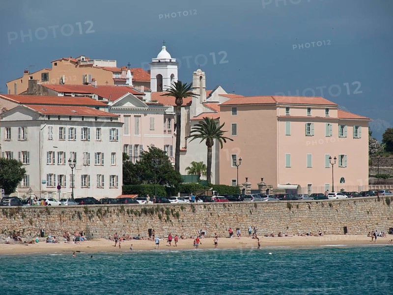 Coastal town with pastel-coloured buildings and beach area, sea view, Corsica, ajaccio, France, Europe