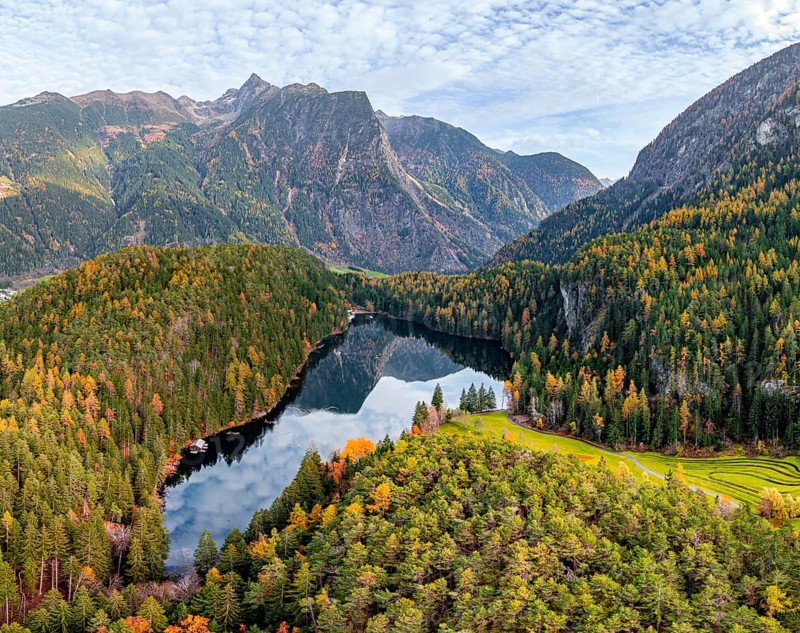 Aerial view, mountain peaks of the Oetztal Alps reflected in Lake Piburger See, in autumn, near Oetz in Oetztal, Tyrol, Austria, Europe