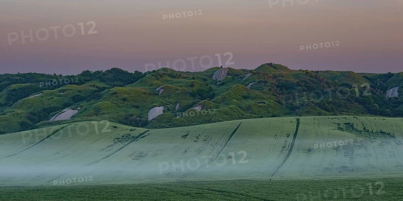 Early morning fog shortly in front of sunrise in the Crete Senesi, Province of Siena, Tuscany, Italy, Europe