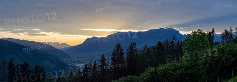 Sunset over the Eisenerz Alps, mountain massif Reiting, in the Liesingtal the village Traboch, panoramic shotView from the lowlands, Leoben, Styria, Austria, Europe