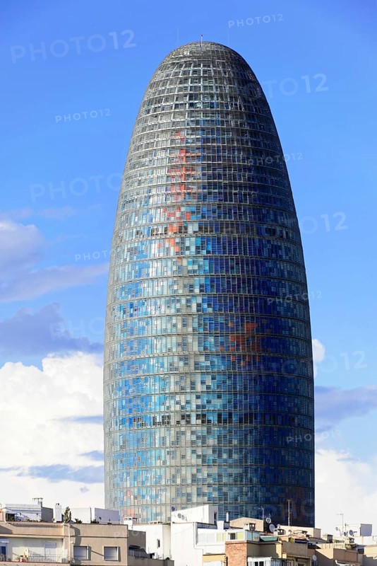 The Tower of Glory, formerly called Torre Agbar, in the Poblenou neighbourhood of Barcelona, Spain, Tall oval skyscraper against a clear sky, architectural masterpiece, Barcelona, Catalonia, Spain, Europe