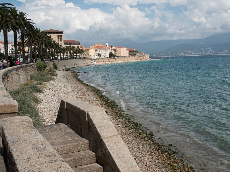 Coastal promenade with a view of the sea and historic buildings in the background, Corsica, ajaccio, France, Europe
