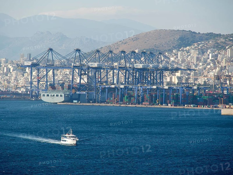 A large harbour with ships and containers, behind it a city and mountains, ancient buildings with columns and trees on the Acropolis in Athens against a blue sky, athens, greece