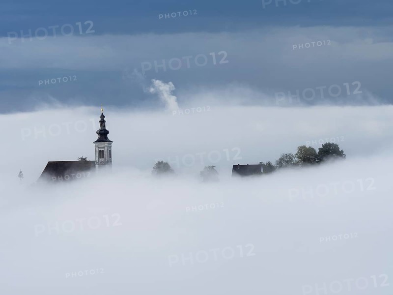 Church tower rises out of the morning mist, Frauenberg pilgrimage church, near Leibnitz, Styria, Austria, Europe