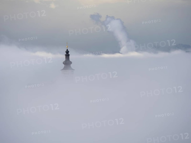 Church tower rises out of the morning mist, Frauenberg pilgrimage church, near Leibnitz, Styria, Austria, Europe