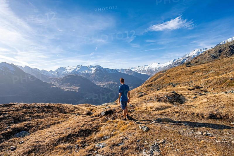 Mountaineers on a hiking trail, Gurgler Seenplatte, behind glaciated mountain peaks of the Gurgler ridge, in autumn, near Obergurgl, Oetztal Alps, Tyrol, Austria, Europe