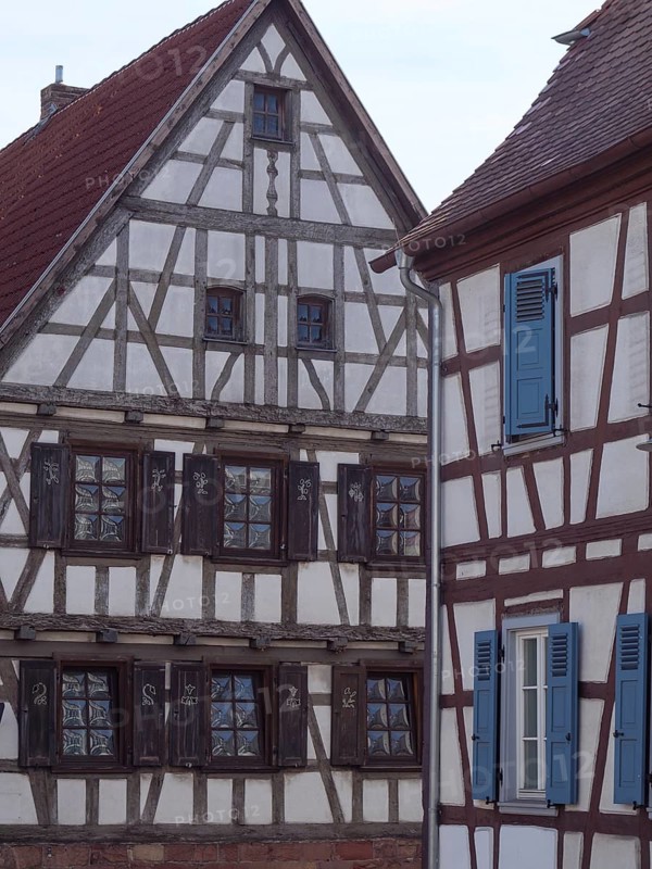 Historic half-timbered house with blue shutters and rustic architectural details, historic half-timbered houses in the Palatinate, kandel, Germany, Europe